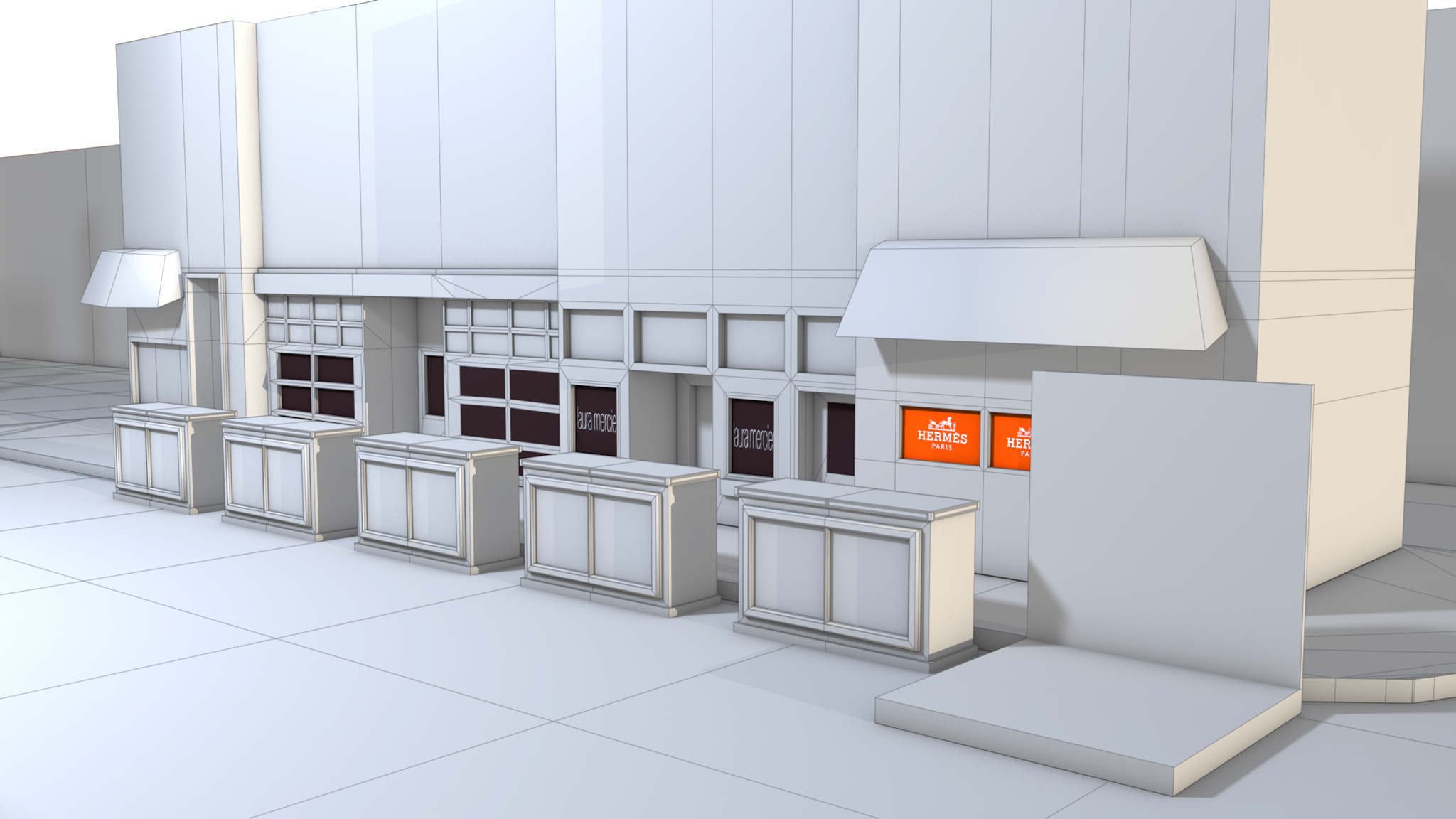 3D model of a store front with display cases and branded signage for Hermes and Laura Mercier.