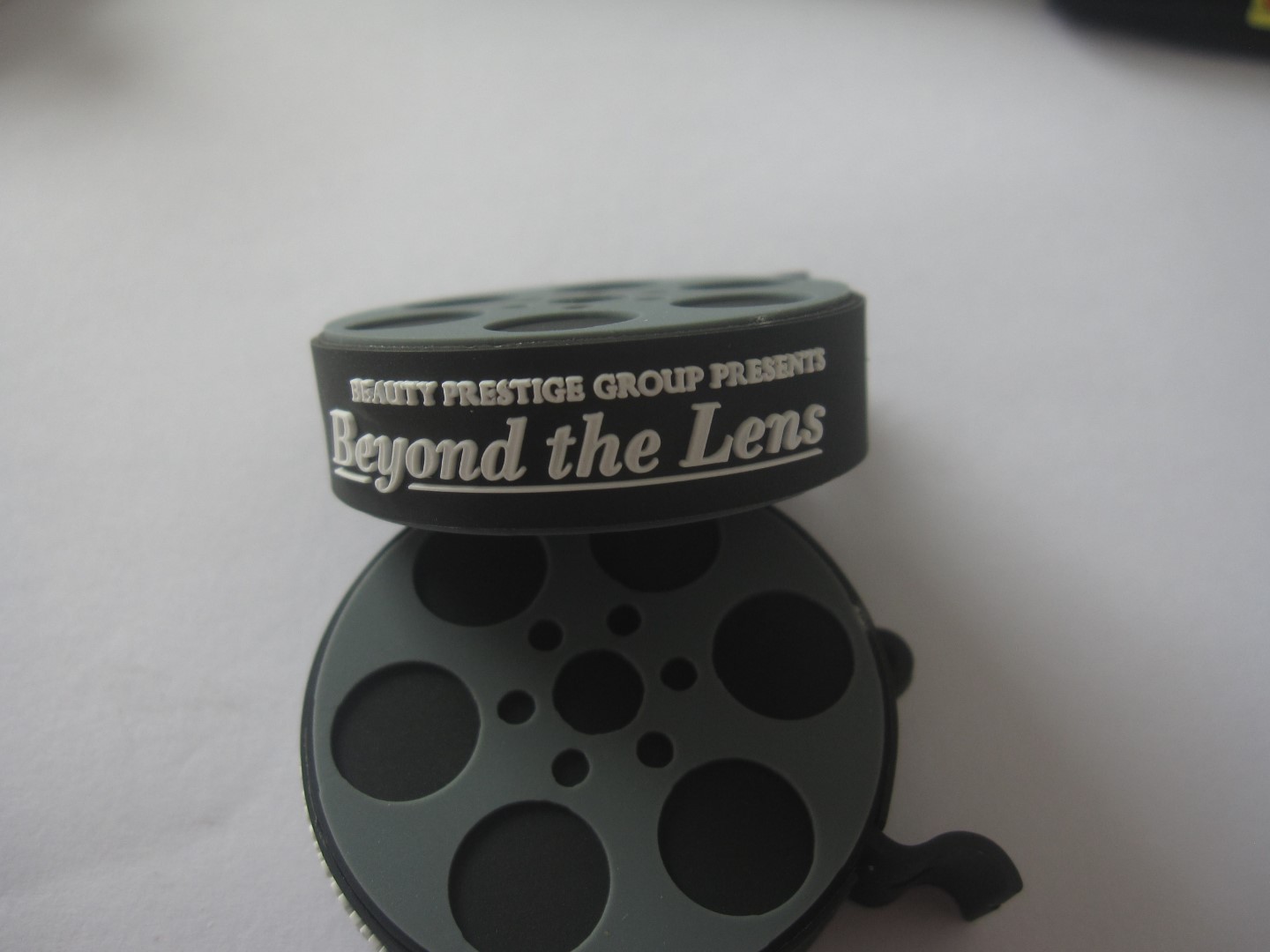Film reel featuring 'Beyond the Lens' by Beauty Prestige Group.