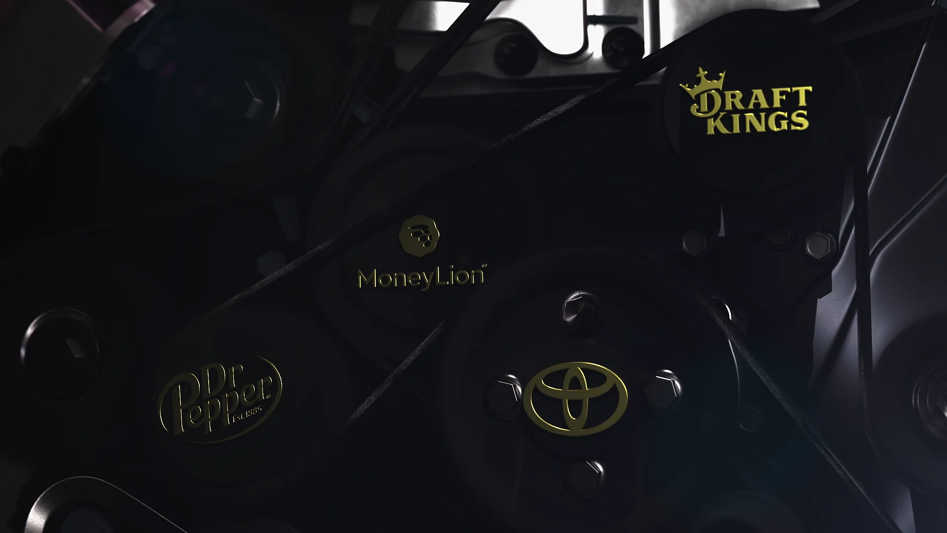 Logos of Toyota, Dr Pepper, MoneyLion, and DraftKings on a mechanical belt system.