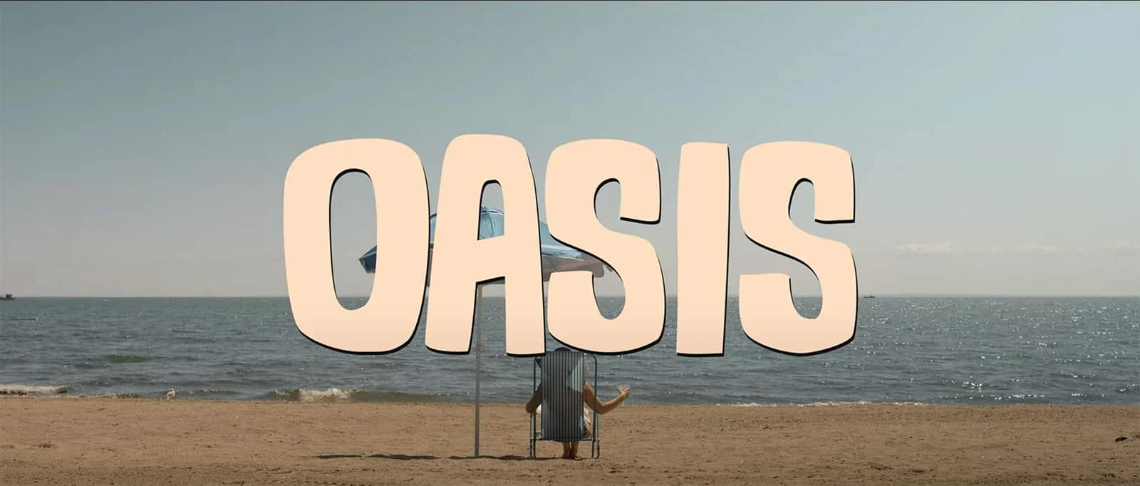 A peaceful beach scene with the word 'OASIS' prominently displayed against the ocean backdrop.