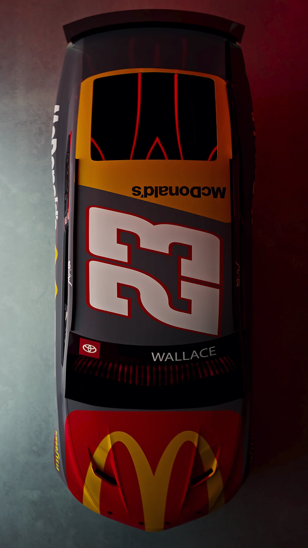 Top view of a NASCAR race car featuring the number 23 and McDonald's branding.
