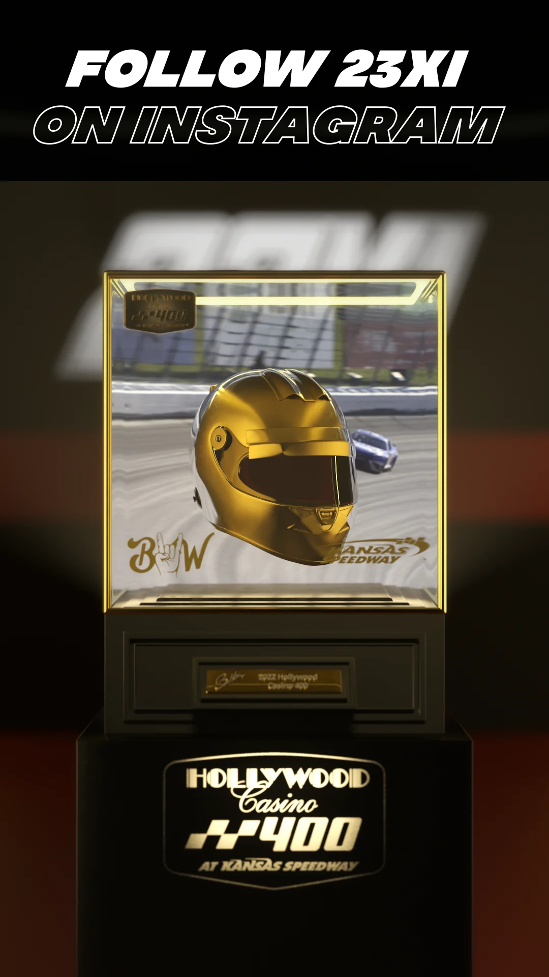 Gold racing helmet displayed in a trophy case for Hollywood Casino 400.