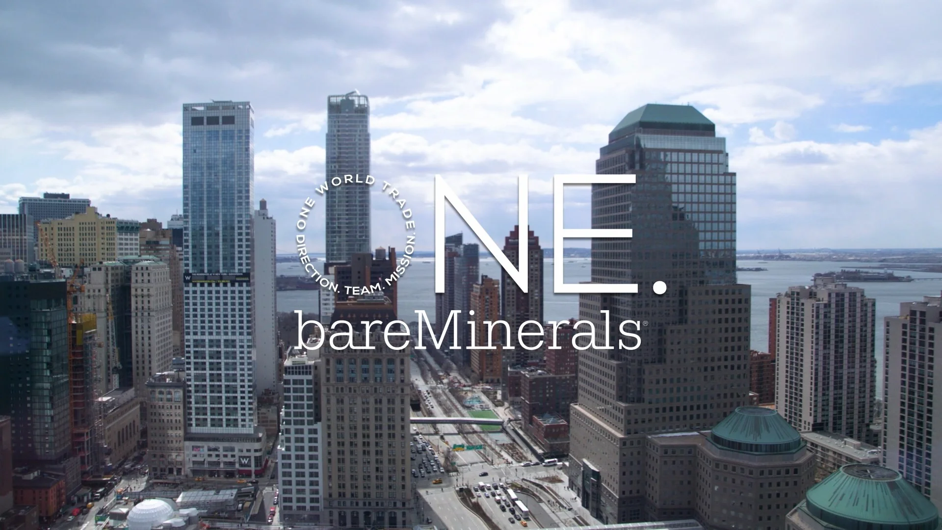 View of New York City skyline featuring One World Trade Center and buildings with the brand 'bareMinerals'.